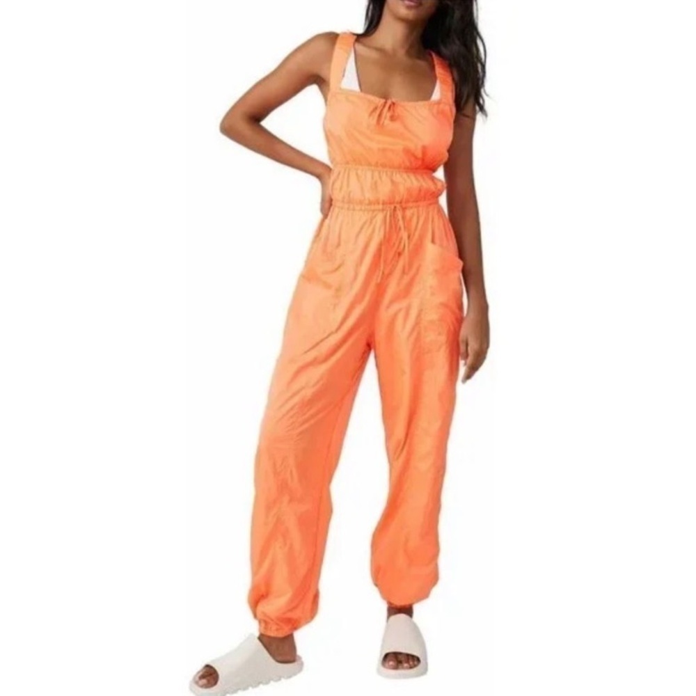 Free People Movement tropic sport one piece orange jumpsuit. Size medium